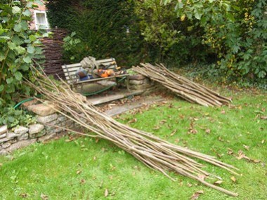 Coppicing              produce. Hedging stakes and binders. Behind the seat is a              section of hurdle also from coppice.